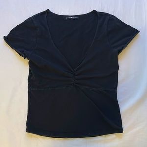 Brandy Melville shirt. Very flattering and a cute basic!